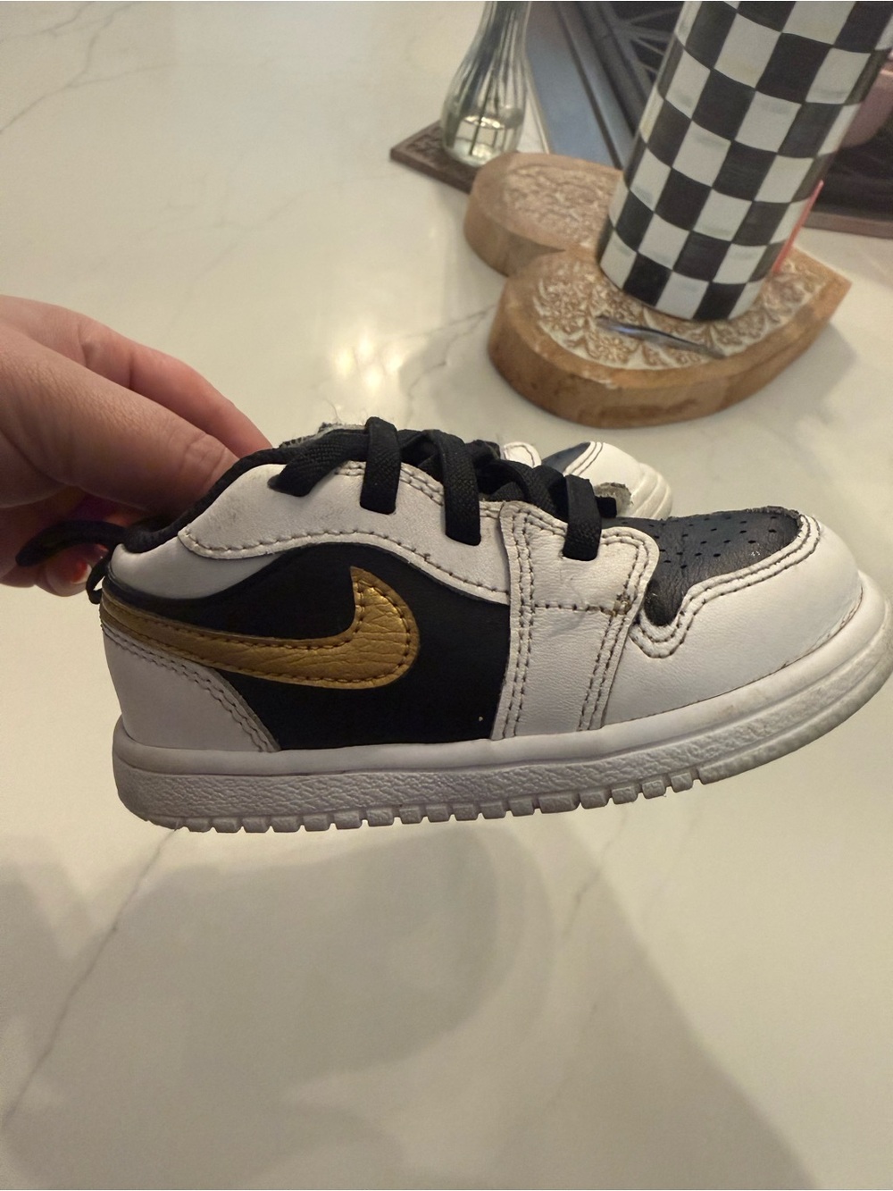 Nike Kids' Black & White Sneaker with Gold Swoosh Jordan's  7c